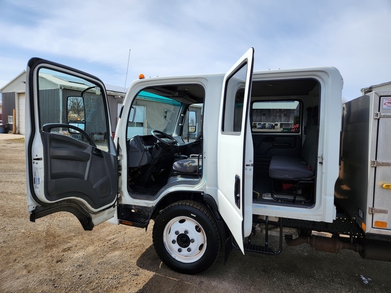 Heavy Trucks  2015 Isuzu NPR HD Dump Truck Photo